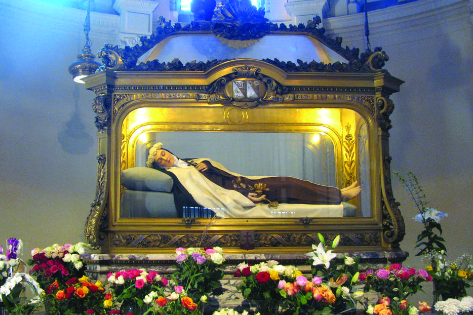 A walking visit of Lisieux takes pilgrims before Thérèse’s tomb at the convent.