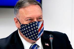 U.S. Secretary of State Mike Pompeo, wearing a mask, attends a signing agreement ceremony in the northern city of Thessaloniki, Greece, on Monday. After a stop in Crete, Pompeo is scheduled to arrive Wednesday in Rome, where he will meet with Vatican and Italian officials and take part in a religious freedom symposium hosted by the U.S. Embassy to the Holy See.