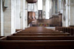 Empty pews inside a Catholic church.