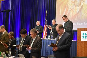 Members of the United States Conference of Catholic Bishops pray together at the beginning of the morning session on the first day of their Fall Meeting in Baltimore, Maryland on Nov. 11, 2019