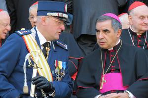 Gendarme Captain Domenico Giani and Msgr. Angelo Becciu, substitute for General Affairs to the Secretary of State, attend the Gendarme parade for the feast of St. Michael the Archangel, their patron, on October 5, 2012.