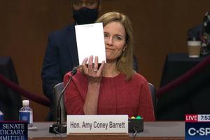 Judge Amy Coney Barrett holds up a blank page during her Senate confirmation hearing on October 12, 2020.