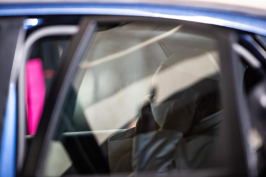 Pope Francis puts on a mask while sitting in his car after the Wednesday general audience inside the San Damaso Courtyard of the Vatican Apostolic Palace, Sept. 9, 2020.