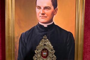 A relic of Blessed Michael McGivney is shown in front of his beatification portrait at St. Mary Church in New Haven, Connecticut. St. Mary Church, the first parish assignment of Father McGivney, was the church where the young priest founded the Knights of Columbus.