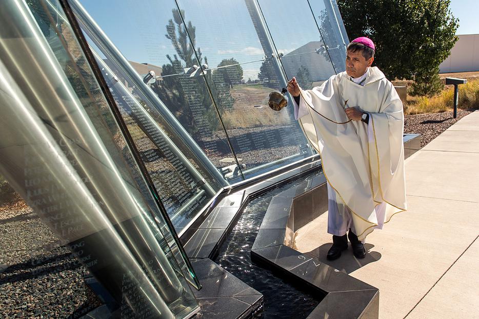 Bishop Jorge Rodríguez blesses the Colorado Freedom Memorial during a Mass Sept. 28, 2019, in Aurora, Colorado.