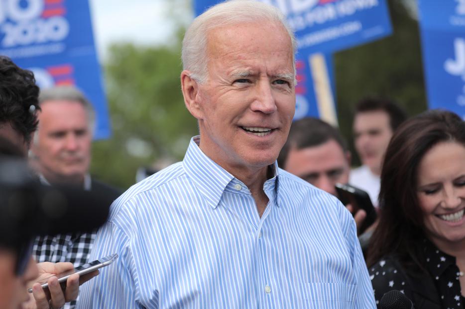 Former Vice President of the United States Joe Biden walking with supporters at a pre-Wing Ding march from Molly McGowan Park in Clear Lake, Iowa, 2019.