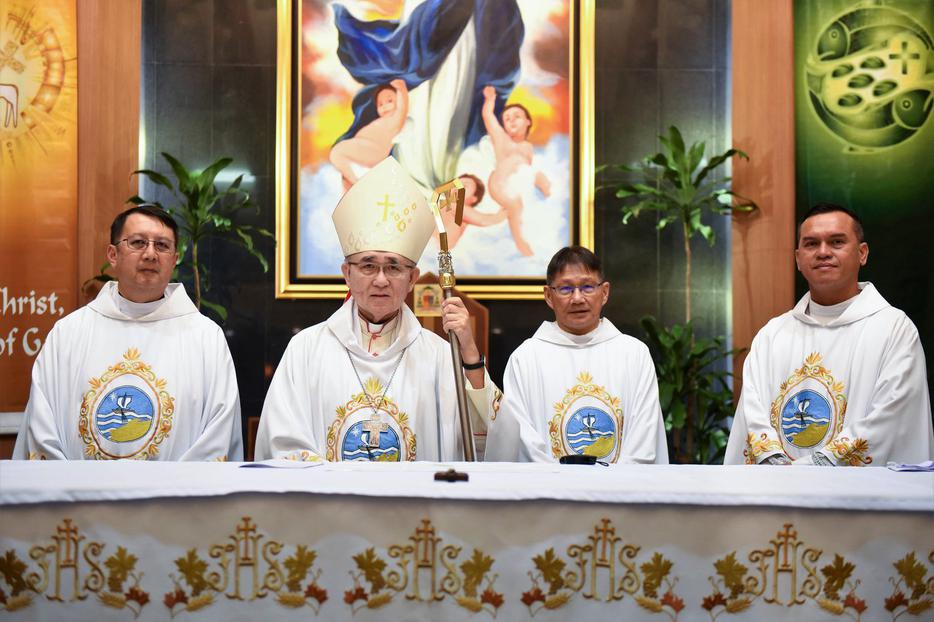 Cardinal-designate Cornelius Sim, shown with his three priests at the 2020 chrism Mass, will be given a red hat later this month.