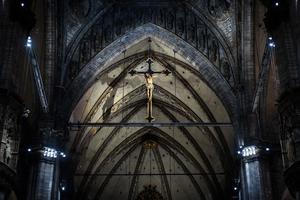 A crucifix above the altar  inside the Duomo in Milan.