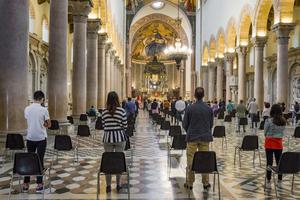 Parishioners safely social-distance during Mass amid the coronavirus pandemic.