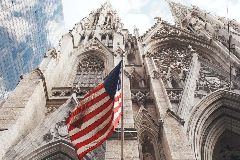 An American flag waves outside of St. Patrick's Cathedral in Manhattan.