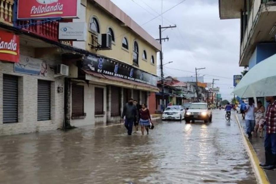 Streets flooded in Lima Nueva Cortes  after two Category 4 storms hit the island.