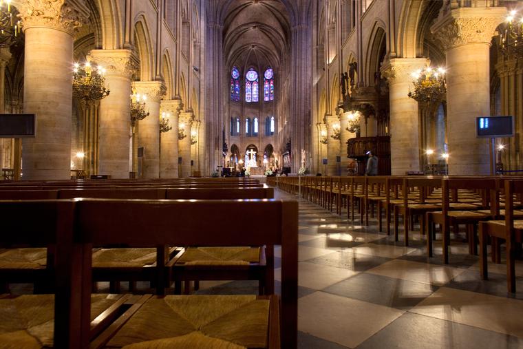 Empty chairs inside the Notre Dame Cathedral.
