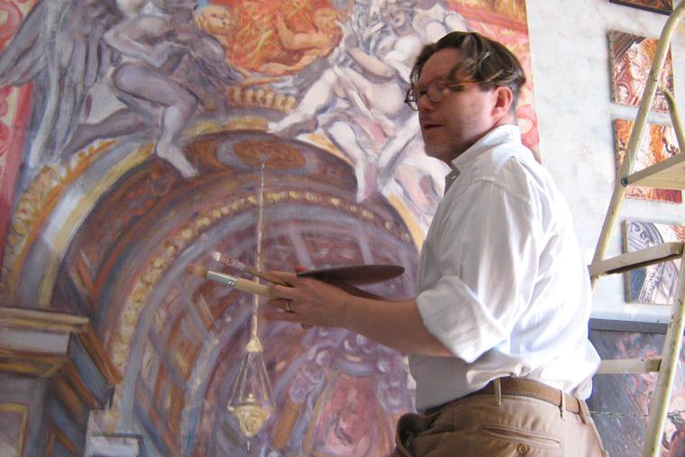 Philippe Casanova works on a painting.