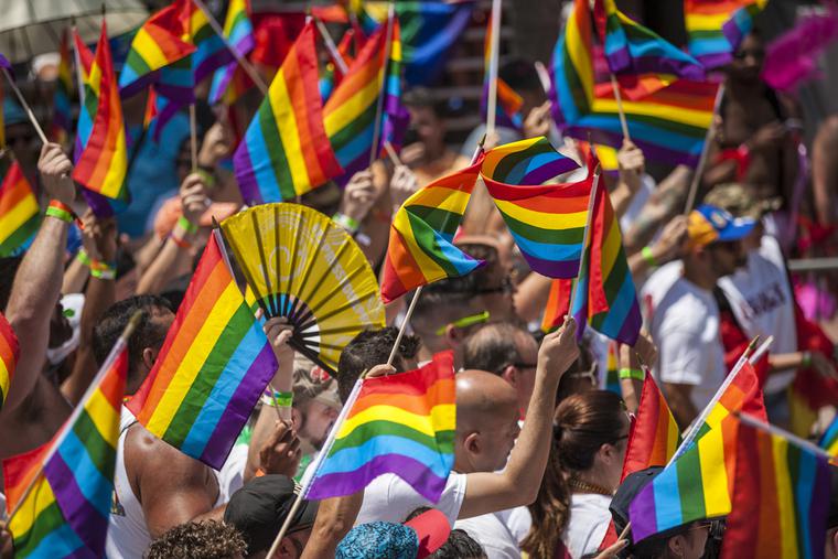 A sea of rainbow flags during a Miami Pride Parade.