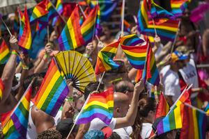 A sea of rainbow flags during a Miami Pride Parade.