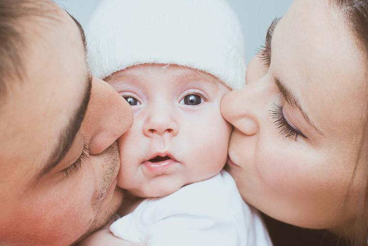 Young mother and father with newborn.