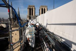 French Culture minister Roselyne Bachelot (1st-R) visits the reconstruction site of Notre-Dame cathedral in Paris, on November 24, 2020.