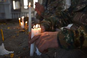 Armenian soldiers pray on Nov. 1 in the damaged Ghazanchetsots Cathedral in the historic city of Shusha.