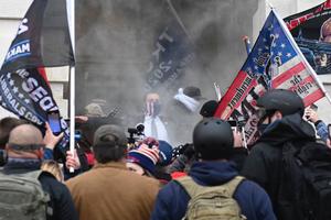 Trump supporters are tear gassed outside the U.S. Capitol in Washington on Jan. 6. Demonstrators breeched security and entered the Capitol as Congress debated the 2020 presidential election Electoral College vote certification.