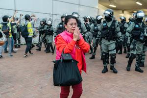 Police shut down the "Stand with Uyghurs" rally at Edingburgh Place in Hong Kong.
