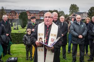 Archbishop Philip Tartaglia gives a blessing at a commemoration of the founding fathers of Celtic F.C. at St Peter’s Cemetery, Dalbeth, Glasgow, Nov. 2, 2013.
