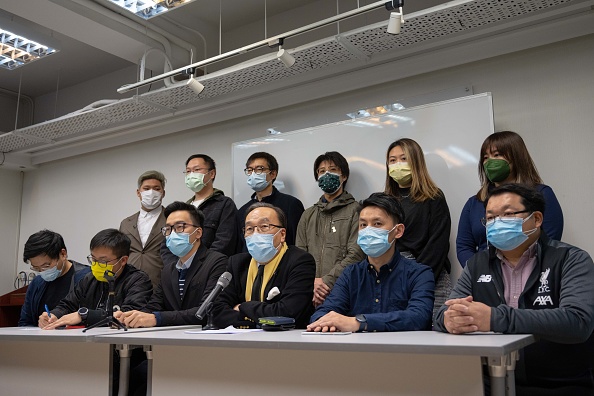 Chairman of the Civic Party Alan Leong (front center) and other members  speaks during a pnews conference on Jan. 6 in Hong Kong. More than 50 Hong Kong opposition figures were arrested under the national security law, deepening a crackdown that the bishop emeritus has spoken out against.