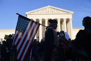 Supporters of Judge Amy Coney Barrett and pro-choice supporters gather outside of the US Supreme Court as the Senate is expected to confirm President Trump's Supreme Court nominee Amy Coney Barrett on Capitol Hill on October 26, 2020 in Washington, DC.