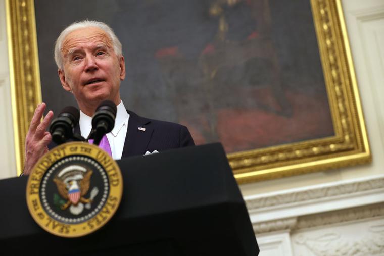 U.S. President Joe Biden speaks during an event in the State Dining Room of the White House January 21, 2021 in Washington, DC.