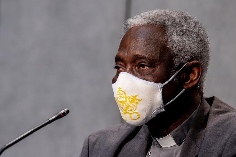 Cardinal Peter Turkson, prefect of the Dicastery for Promoting Integral Human Development, shown wearing a mask during a news conference on July 7, 2020, says the Vatican is committed to participating in dialogue about economic matters that impact the worldwide common good.