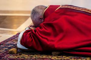 Pope Francis venerates the Cross during the liturgy for the Lord's Passion in St. Peter's Basilica on Good Friday.