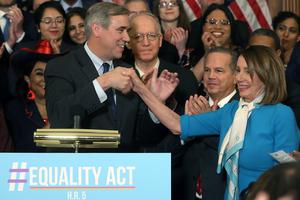Sen. Jeff Merkley (D-OR) introduces House Speaker Nancy Pelosi (D-CA) during a news conference where House and Senate Democrats introduced the Equality Act on March 13, 2019, in Washington, D.C. The 2019 bill failed after resistance from President Donald Trump and a Republican-led Senate, but a new version of the legislation is being advanced in the 117th Congress.