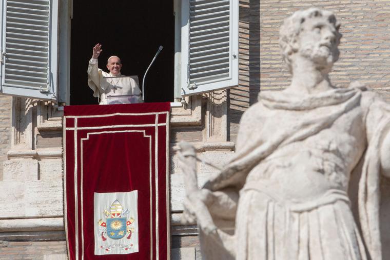 Pope Francis waves to pilgrims after the Sunday Angelus in St. Peter's Square, Oct. 27, 2019.