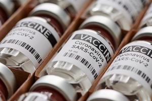 A box of vials holding the COVID-19 vaccine. A box of vials holding the COVID-19 vaccine.