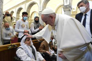 Pope Francis blesses a young boy during his visit to the Church of the Immaculate Conception in Bakhdida (Qaraqosh), Iraq, March 7.