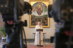 Pope Francis delivers a Regina Coeli address in the library of the Apostolic Palace.