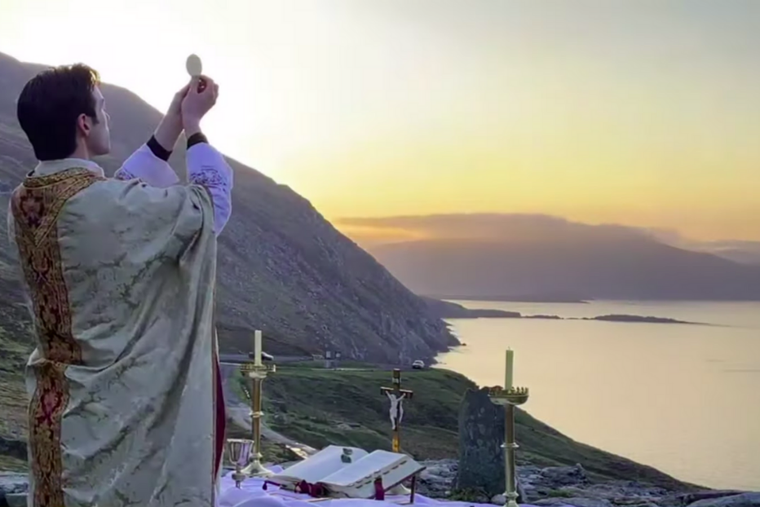 Fr. Gerard Quirke celebrated Easter Sunday Mass at dawn from Keem Bay, Achill Island, an ancient site upon a cliff in Ireland.
