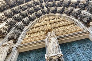 Crescent moon Madonna above the left main entrance   of Cologne Cathedral.