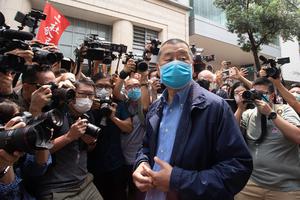 Hong Kong media tycoon and founder of Apple Daily newspaper Jimmy Lai Chee Ying arrives at the West Kowloon Magistrates' Court.
