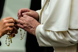 Pope Francis holds a rosary after the Wednesday general audience inside the Vatican's Paul VI Hall, Aug. 7, 2019.