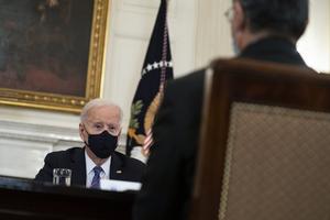 Health and Human Services Secretary Xavier Becerra listens as President Joe Biden speaks about the southern border during a meeting in the State Dining Room of the White House March 24 in Washington.