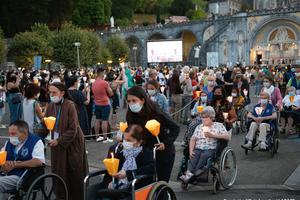 Pilgrims at the Sanctuary Our Lady of Lourdes in France.
