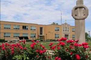 Cathedral High School terminated Joshua Payne-Elliott’s contract in June 2019. After reaching a settlement with the school, he filed a lawsuit against the archdiocese in August 2019.