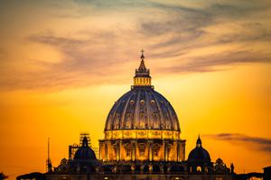 Dome of St. Peter's Basilica at sunset.