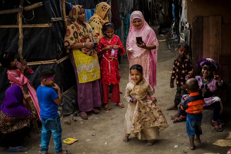 Rohingya Muslim refugees gather during the Eid al-Fitr holiday inside their temporary settlement on May 14, 2021 in New Delhi, India. A lockdown is in effect as COVID-19 cases have surged in India, causing a shortage of oxygen supplies across the country.