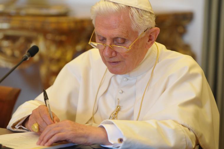 Pope Benedict XVI is shown writing on Aug. 28, 2010.