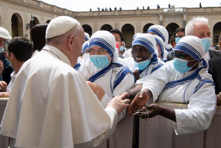Pope Francis greets Missionaries of Charity June 2 2021 in the San Damasco Courtyard of the Apostolic Palace after a general audience.