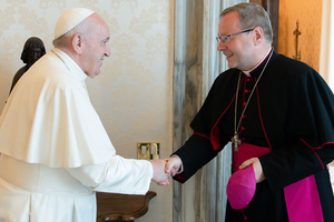 Pope Francis greets Bishop Georg Bätzing for a private audience at the Vatican on July 24, 2021.
