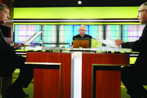 Above, from left, Archbishop Allen Vigneron of Detroit, Archbishop José Gomez of Los Angeles and Msgr. Jeffrey Burrill take part in the U.S. bishops’ June
16-18 virtual assembly.