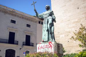 A statue of St. Junípero Serra is pictured June 22 in Palma de Mallorca, Spain, after it was sprayed with graffiti reading "Racist."