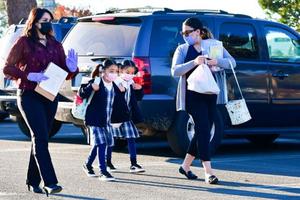 Students arrive at St. Joseph Catholic School in La Puente, California, on Nov. 16, 2020.